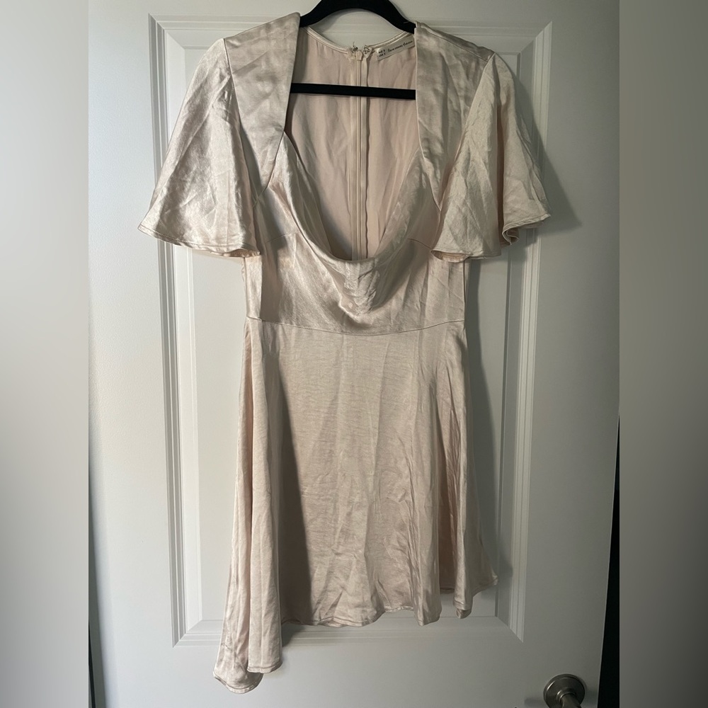 Elegant Cream Mini Dress with Draped Neckline